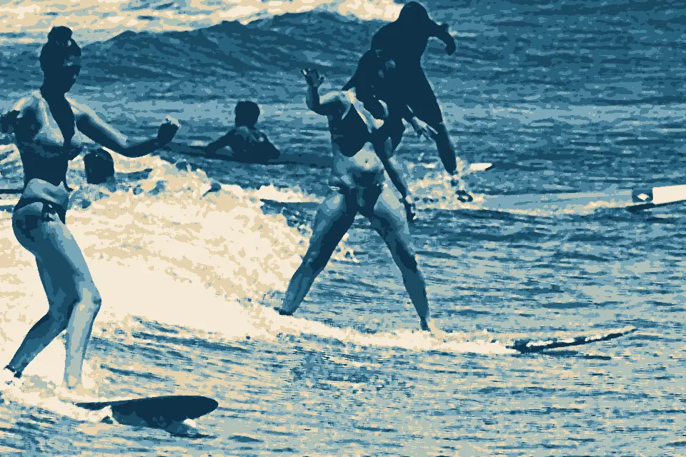 Charley Young Beach: Two women surfing side by side at Kalama beach